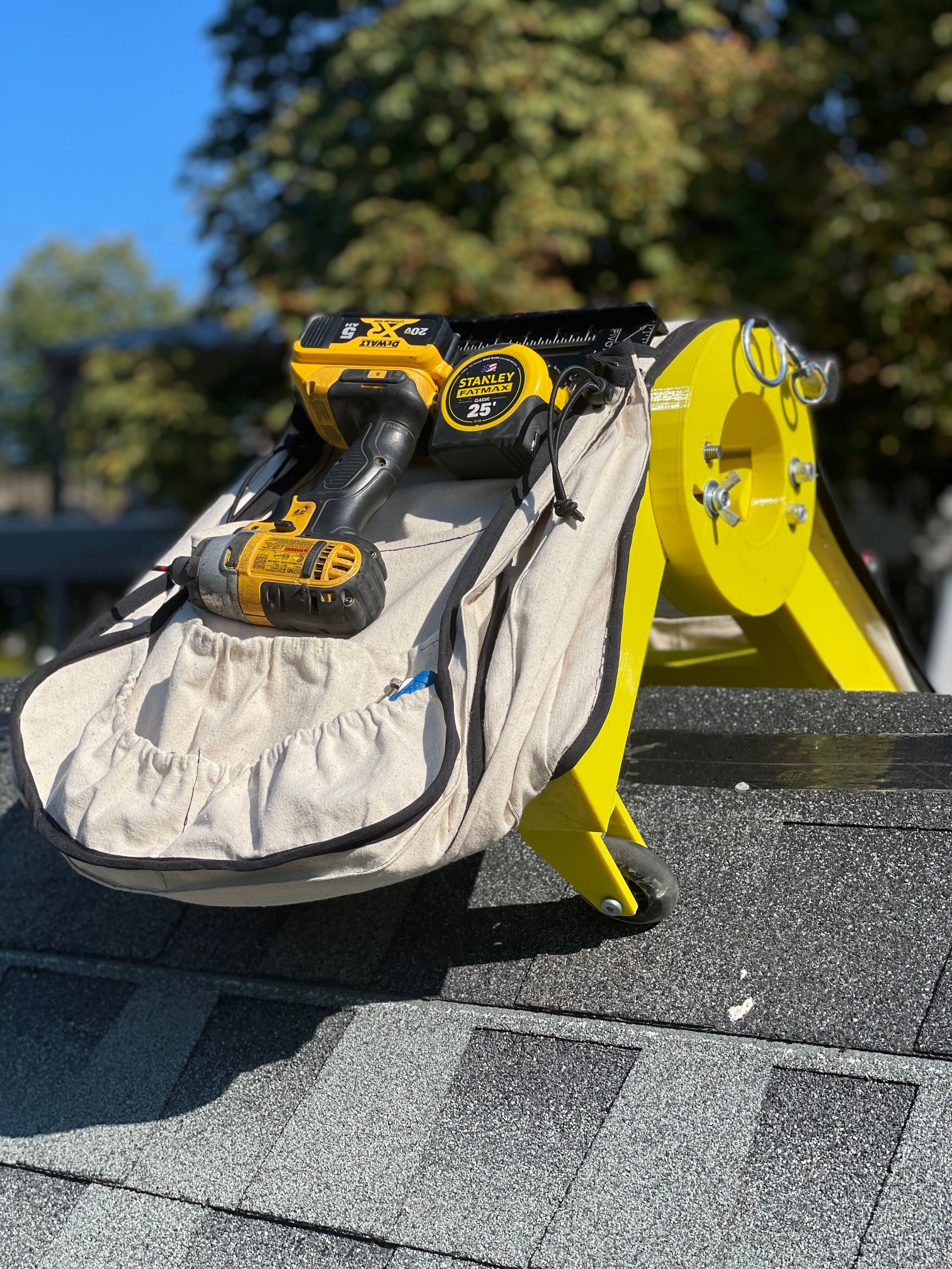 Ridge Rider™ with DeWalt drill and Stanley tape measure on rooftop